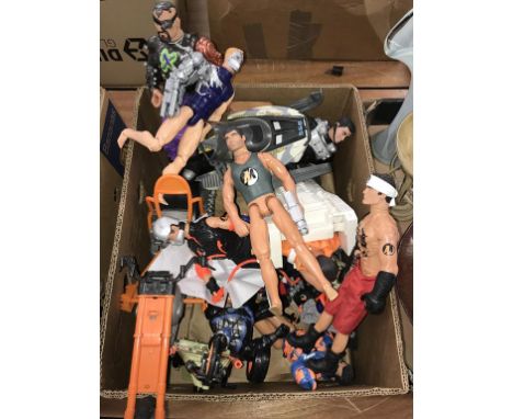A box of Action Man figures