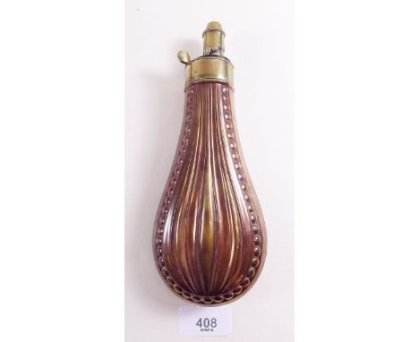 A 19th century copper powder flask