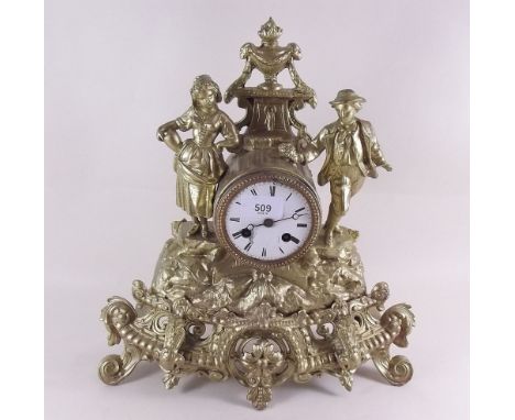 A French gilt metal mantel clock decorated figures 
