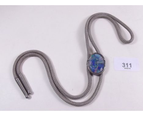 A silver framed opal doublet on bowler tie cord 