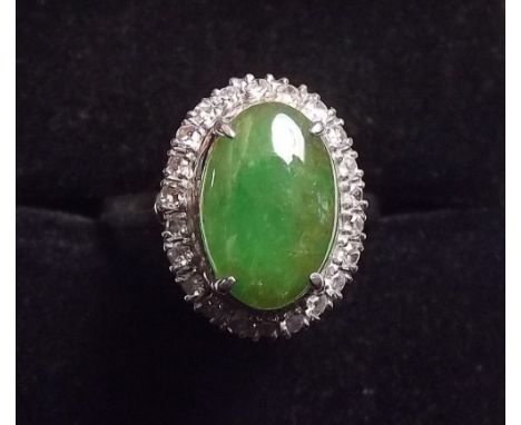 A white gold jade and diamond cluster ring 