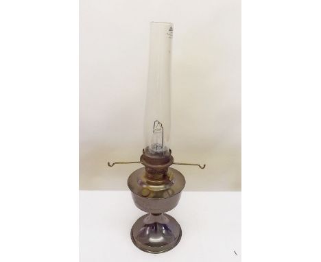 A brass Aladdins lamp and spare glass funnels and wicks 