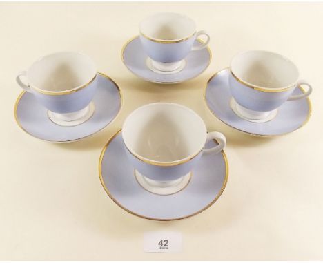 A Royal Doulton part dinner service comprising four cups and saucers, four bowls, four dinner plates and one side plate 