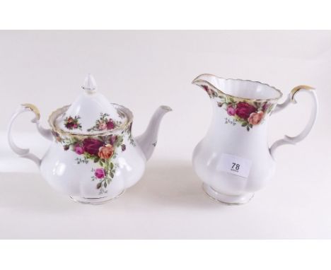 A quantity of Royal Albert Country Roses tea ware including: teapot, large jug, cake stand, various cups and saucers, tray, c