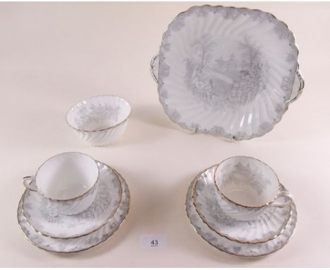 An Aynsley tea service decorated landscapes in grey comprising: six cups and saucers, six tea plates, cake plate and sugar 
