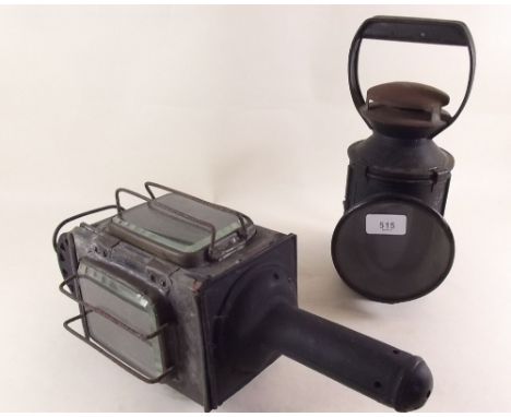An old carriage lamp and a hand lamp