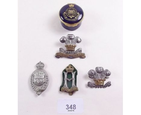 Four assorted cap badges and a Gloucester Yeomanry Cavalry Halcyon Days commemorative 1984 trinket box