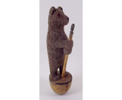 A Steiff bear form skittle on wooden base,  24cm high