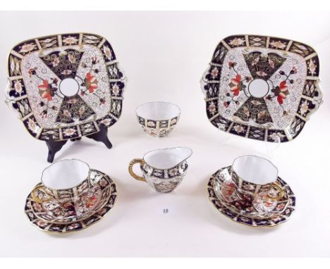A Royal Crown Derby Imari tea service pattern No 2451 comprising: six cups and saucers, six tea plates, two cake plates, milk
