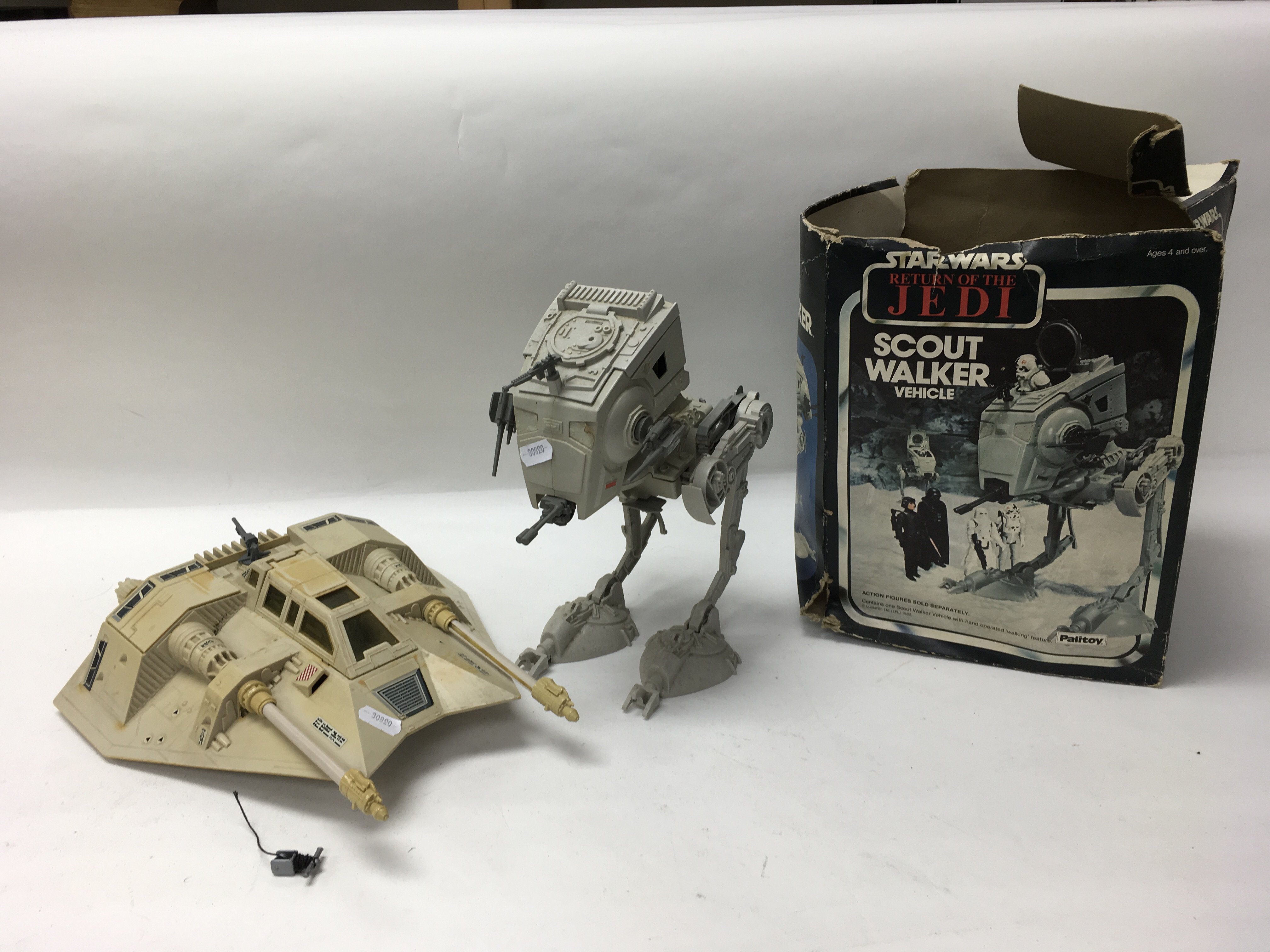 A collection of vintage Star Wars vehicles including an ATAT Walker, a boxed Return of The Jedi