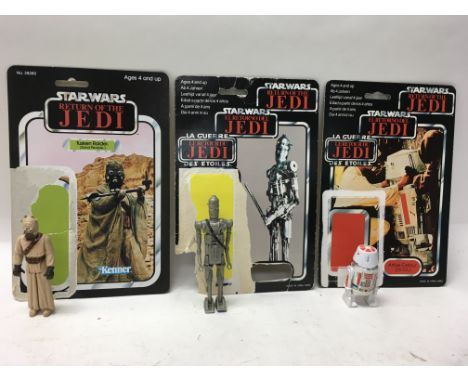 A collection of vintage Star Wars: Return of The Jedi figures with original card backs including R5-D4, Tuskegee Raider, Land