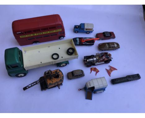 An unboxed Chitty Chitty Bang Bang with fins with a collection of various playworn Dinky and other toys.