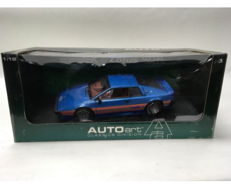 A boxed auto art Lotus Esprit Essex 1:18 scale together with a Lotus Esprit V8 1:43 scale.