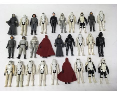 A collection of vintage Star Wars figures including various Storm Troopers, Imperial Commander, Darth Vader etc. Some weapons