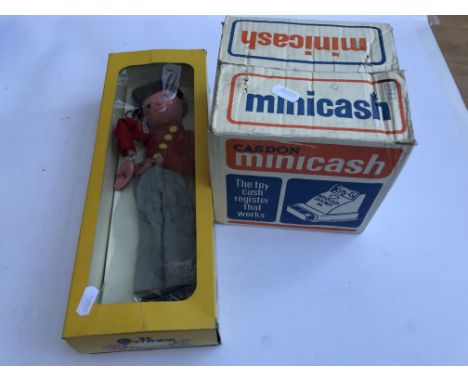 A boxed Pelham puppet and a small boxed Casdon shop till.