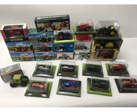 A collection of boxed model tractors including ERTL ( National Farm Toy Show), AGCO, Britain’s, Case, Steyr, Brian Norman, Be