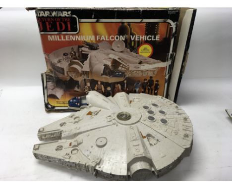 A boxed Star Wars: Return of The Jedi Millenium Falcon Vehicle (cockpit cover missing) with original manual together with a b