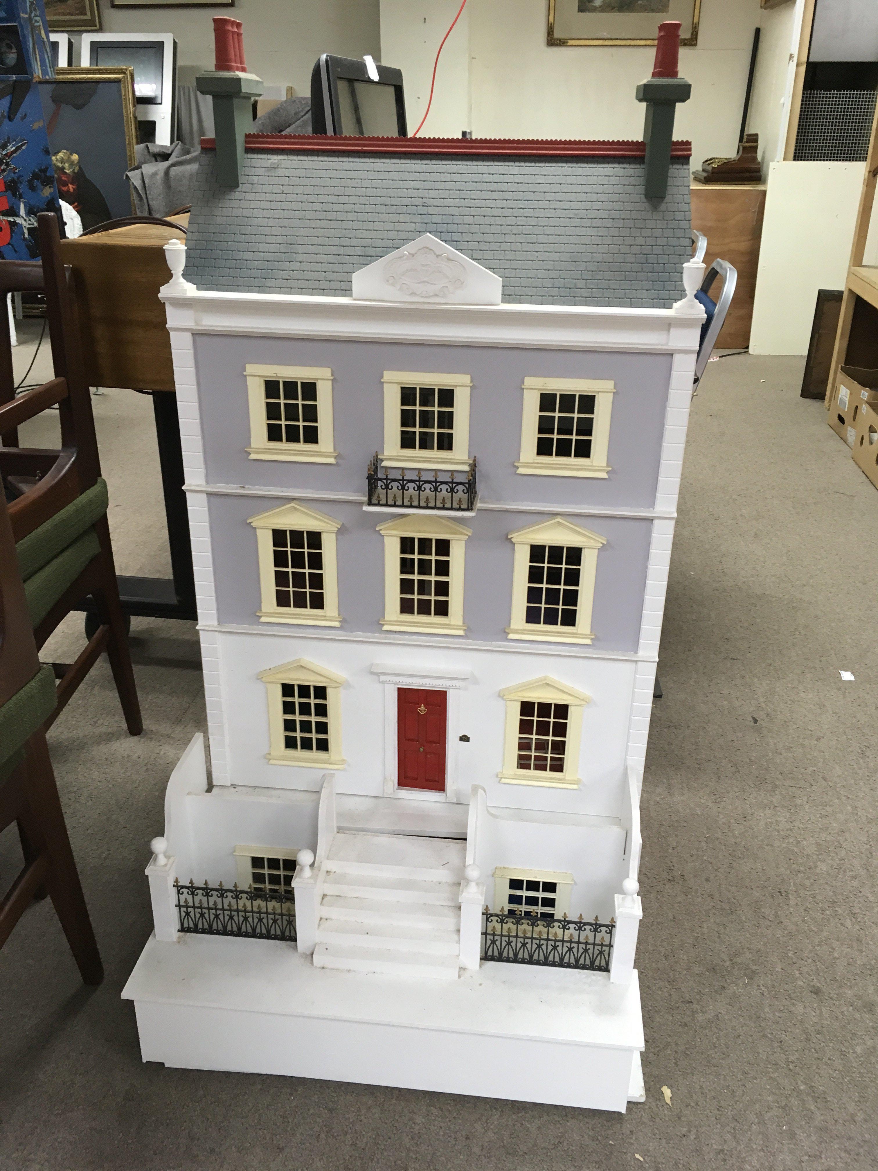 A large multi storey regency era dolls house together with a large