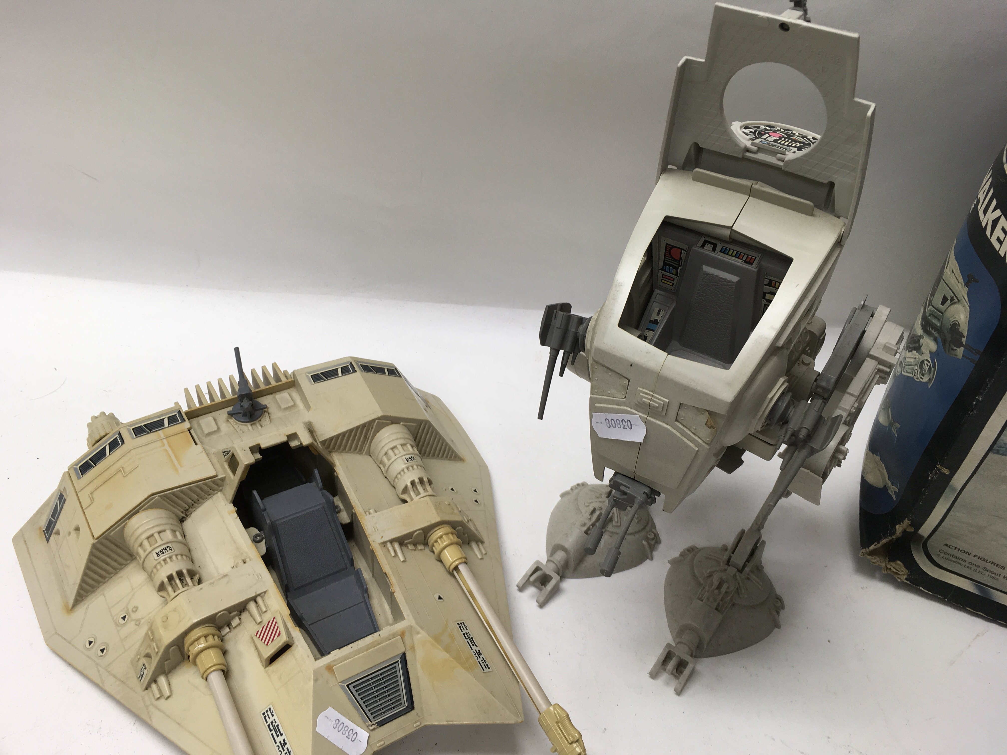 A collection of vintage Star Wars vehicles including an ATAT Walker, a boxed Return of The Jedi