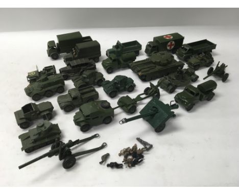 A collection of unboxed Dinky Toys military vehicles and a Britain’s gun.