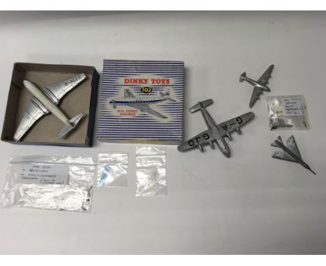 A boxed playworn Dinky D.H.Comet airliner No.702 together with three unboxed Dinky aircraft