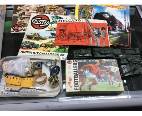 A collection of Airfix model tanks, 29 32nd scale footballers and airfix catalogues together with plastic meccano and wooden 