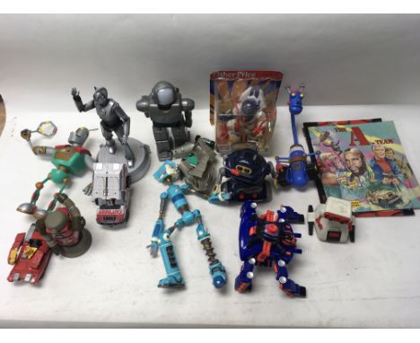 A collection of various robot toys including Tomy.