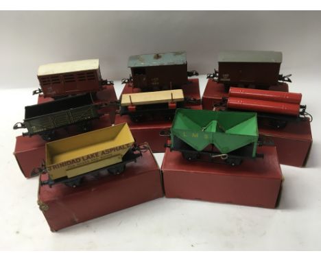 A collection of boxed Hornby “ O “ gauge railway goods wagons including Crane Truck, Side Tipping wagon, Estonia Tanker, Hopp