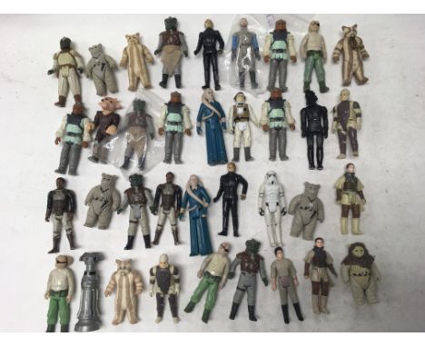 A collection of vintage Star Wars figures with some other more modern toys including a 1997 ghost Obi Wan Kenobi figure.