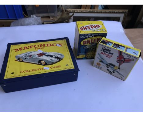 A Matchbox collectors case containing mixed cars (incomplete), a boxed Battle of Britain Dinky Stuka and a Marx Dr. Who Dalek