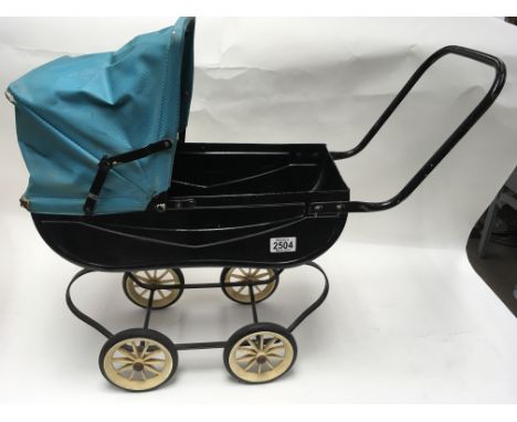A small vintage doll’s pram
