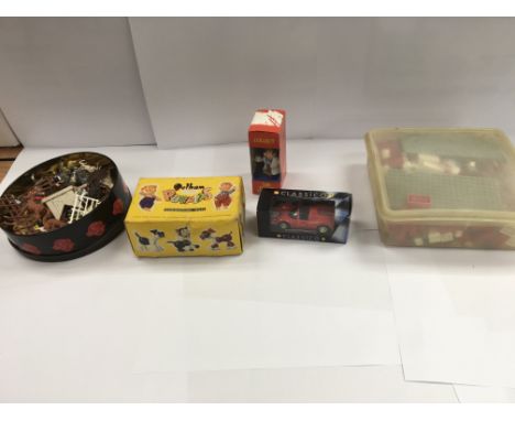 A collection of toys to include a Pelham puppet, Tetley teafolk and model vehicles.