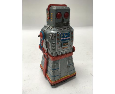 A Japanese giro mechanism tin plate Atom Robot.