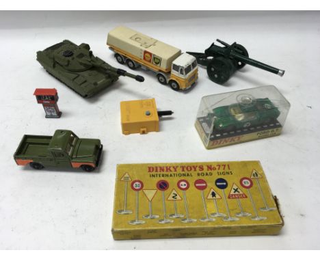 An unboxed Dinky Chieftain Tank, a boxed Dinky Ford GT No. 215, an unboxed Dinky Supertoys Leyland Octopus, a Britains gun an