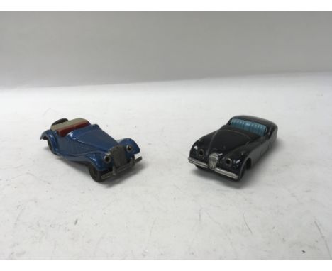 Two vintage tinplate scalex models of an MG TF and a Jaguar XK120