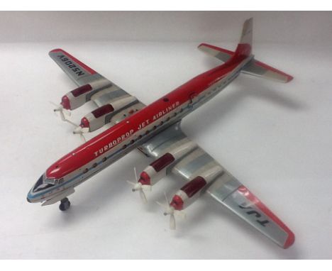 An unboxed Japanese battery operated tin plate turbo prop jet airliner N5206V by Yonezawa 1962 .Jet has flashing lights, movi