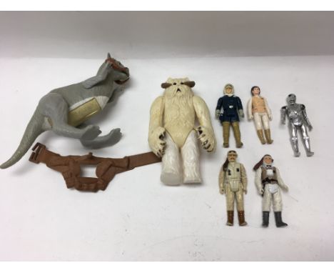 A collection of vintage Star Wars figures including a soft belly Tauntaun, a Hoth Wampa, a Death Star Droid, C3PO, R2-D2 etc.