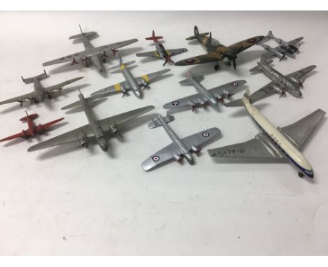 A collection of unboxed Dinky Toys aircraft including a spitfire.