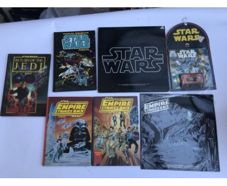 2 Star Wars soundtracks LP records, a sealed read alone cassette and book plus 4 vintage a Star Wars annuals and a collection
