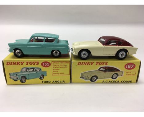 A collection of boxed Dinky Toys including a Ford Anglia No. 155, an A.C. Aceta Coupe No. 167, a pair of Volkswagen Beetles N