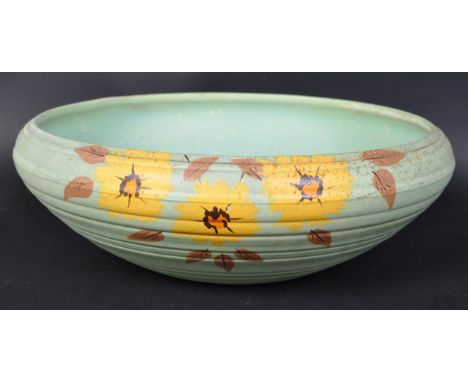 Aston Brentleigh ware, England. A retro vintage 20th Century centre piece fruit bowl. In a green colourway with yellow floral