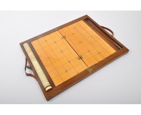 A vintage retro mid 20th century circa. 1960's Chinese chess Xiangqi 'elephant chess' travel board game. Held within a wooden