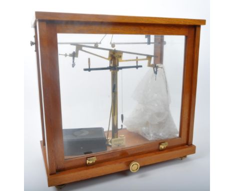 A vintage mid 20th century circa 1960s Philip Harris Ltd precision scale cased in oak &amp; glass display case, together with