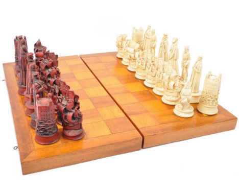 A vintage 20th century acrylic chess pieces with board. The set having medieval themed pieces in white &amp; red. Average siz