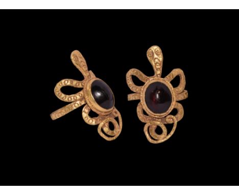 Ptolemaic Period, 332-30 BC. A gold finger ring comprising a flat-section hoop with serpent detailing to the coiled tail and 