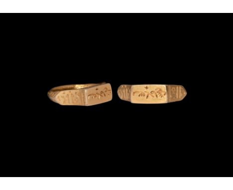 11th-13th century AD. A gold finger ring comprising a cusped D-section hoop with running zigzag pattern, scooped shoulders wi