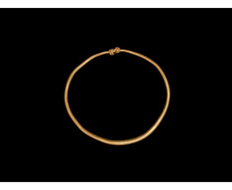 Early 2nd century AD. A gold bracelet formed as a tapering round-section rod with the ends coiled about the shank. Cf. Ruseva