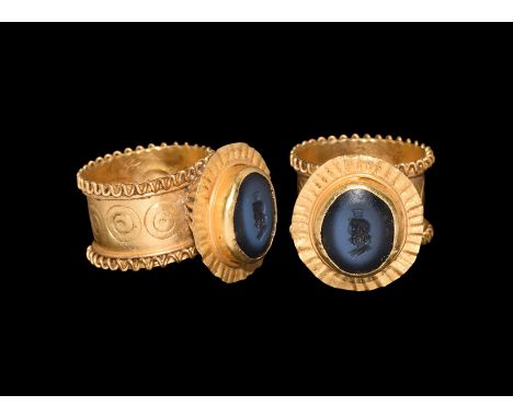 5th century AD. A black onyx gem intaglio bust of Serapis with modius above the head, set into a later gold ring comprising a