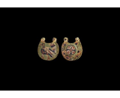 10th-11th century AD. A silver-gilt D-shaped gusseted Rus pendant with enamelled polychrome motifs: to the obverse an advanci