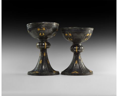 14th century AD or later. A silver chalice pair, each a hemispherical bowl with baluster and flared foot; the bowl with stepp